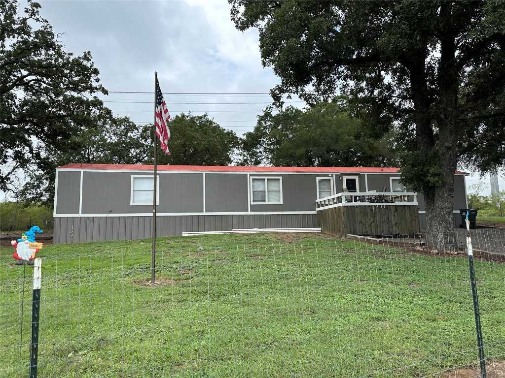 photo 1: 344 Derrick Road, Luling TX 78648