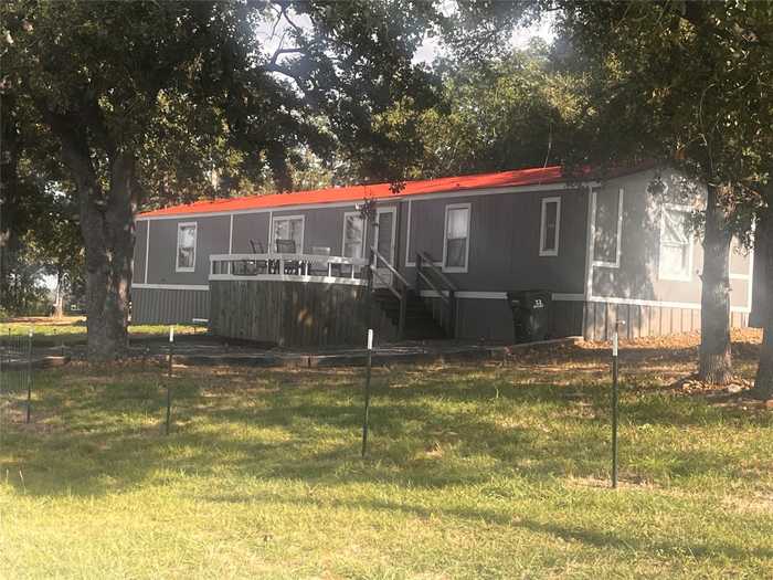 photo 1: 344 Derrick Road, Luling TX 78648