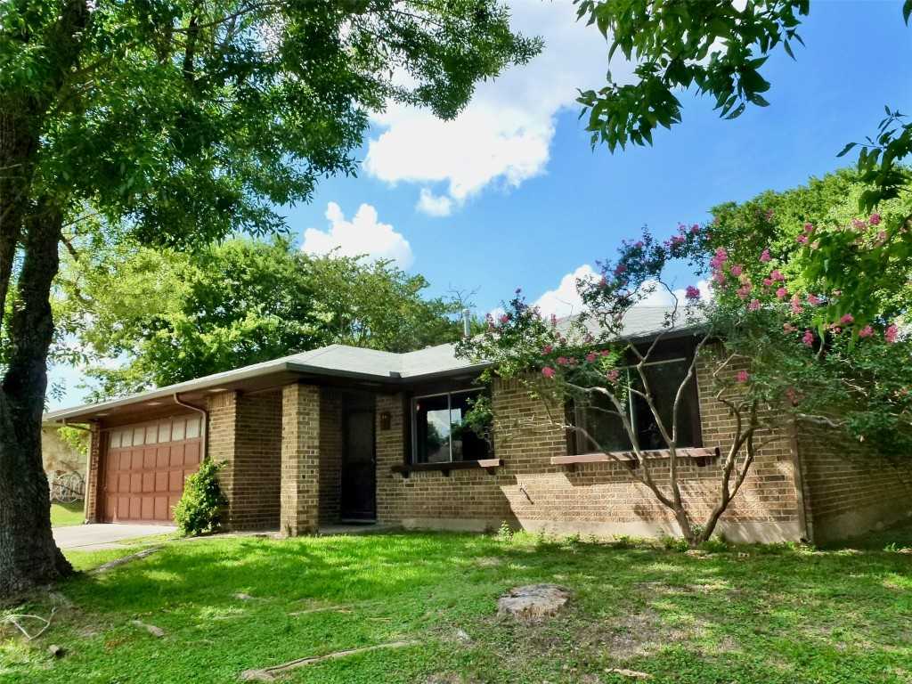 photo 1: 1400 Cripple Creek Drive, Austin TX 78758