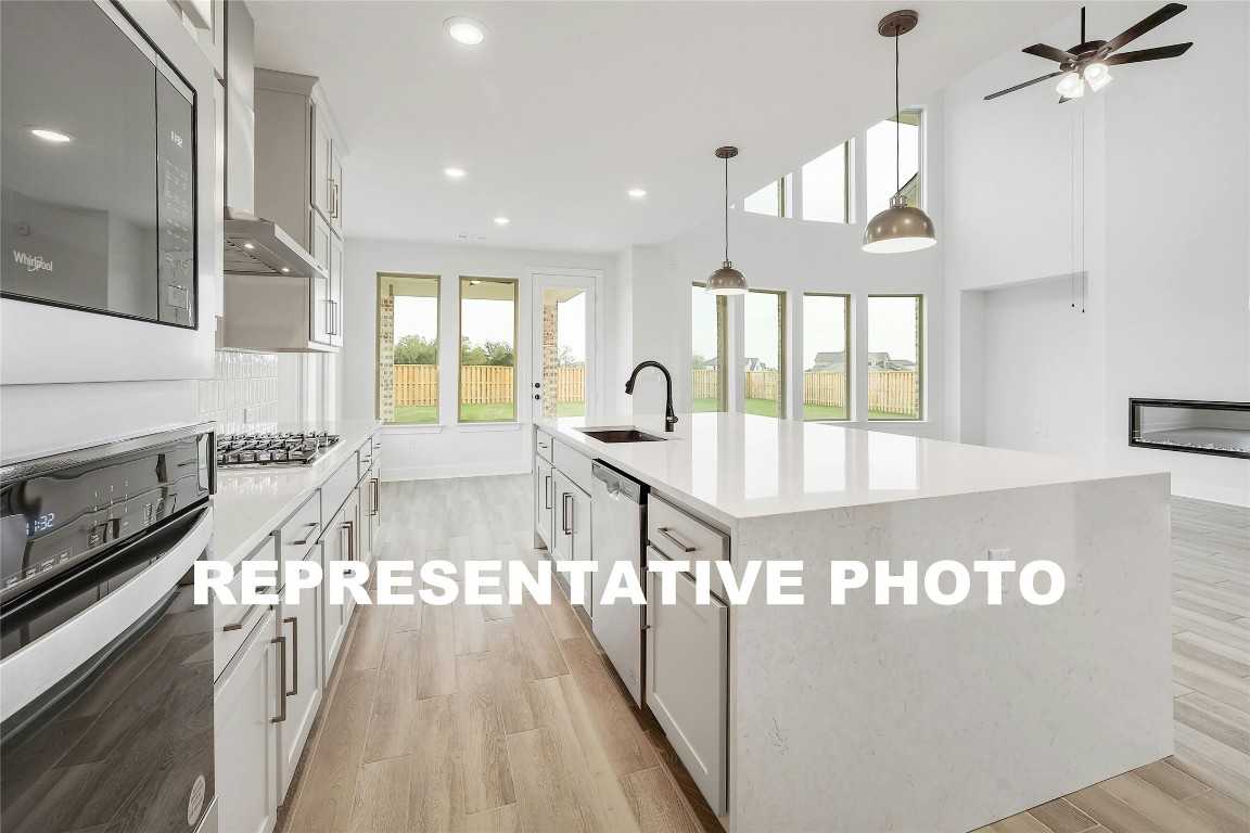 photo 1: 7725 Becasseau Drive, Austin TX 78738