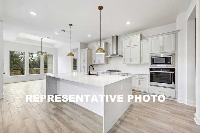 photo 1: 7624 Becasseau Drive, Austin TX 78738