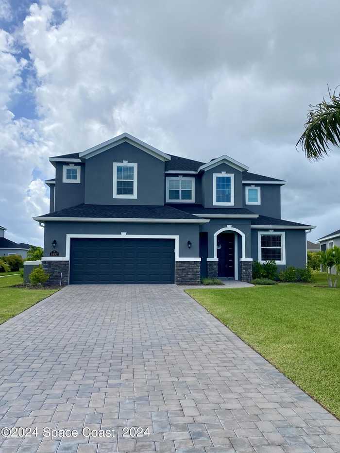 photo 1: 8432 Paragrass Avenue, Melbourne FL 32940