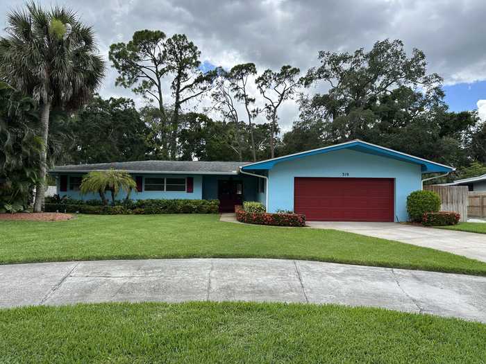 photo 1: 319 Meadowood Lane, Melbourne FL 32904