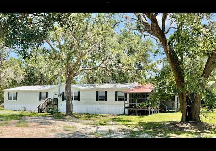 photo 1: 409 SW Hike Lake Road, MADISON FL 32340