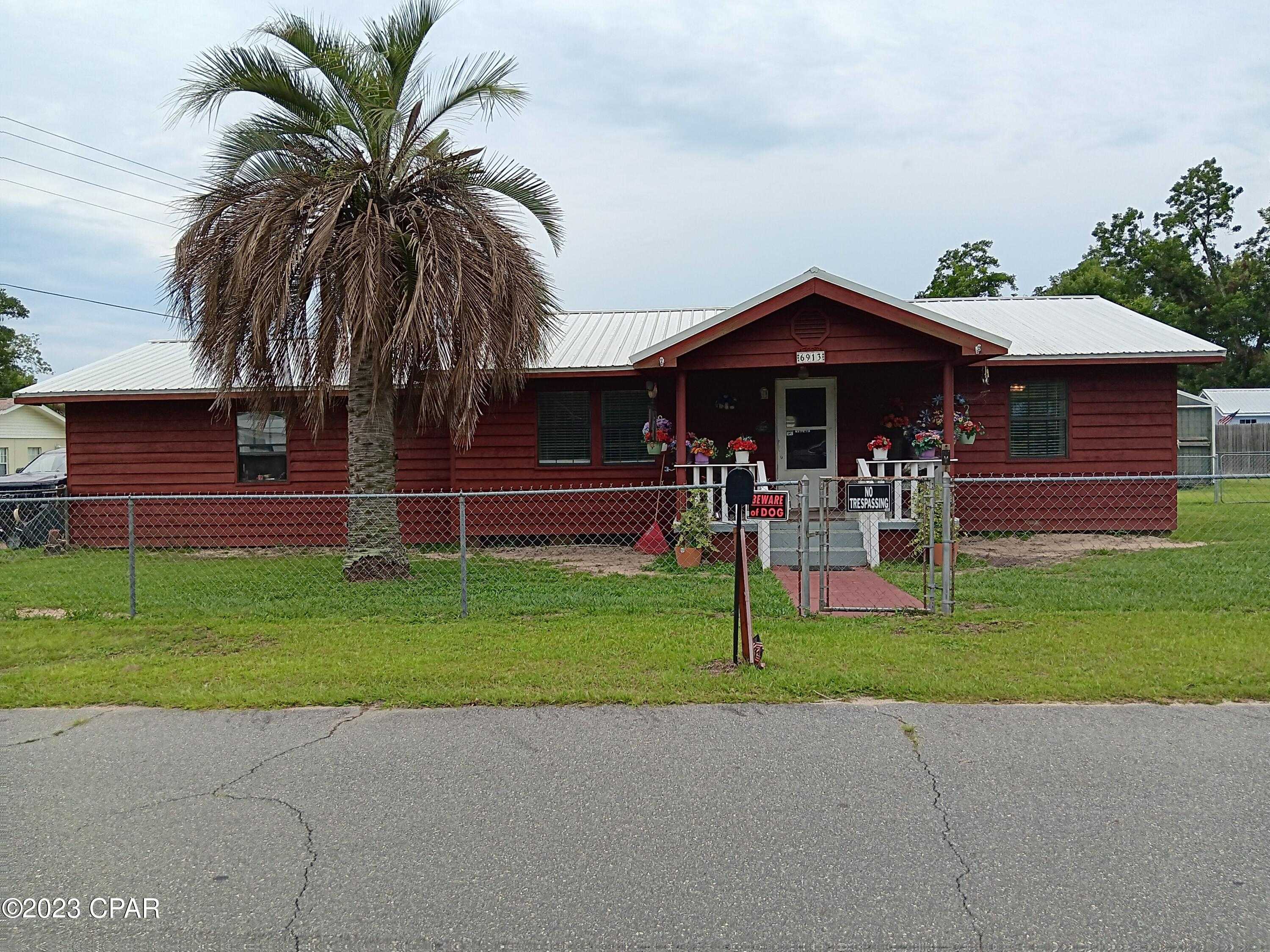 photo 1: 6913 Broadway Street, Grand Ridge FL 32442