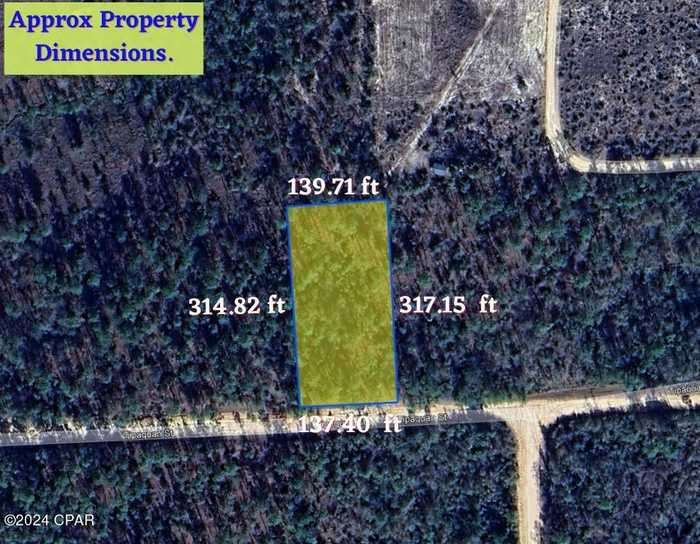 photo 1: Tipaquan Street, Marianna FL 32448