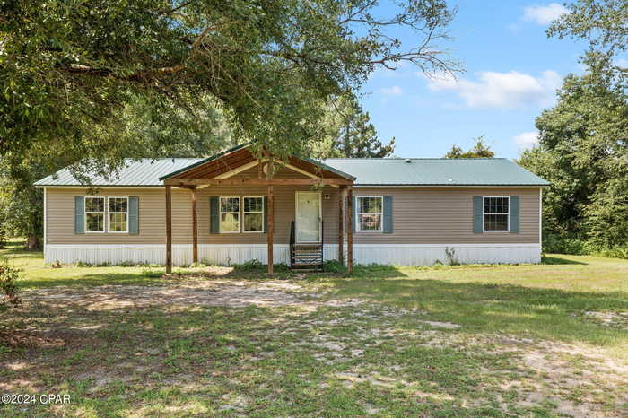 photo 1: 3985 Wilderness Road, Vernon FL 32462