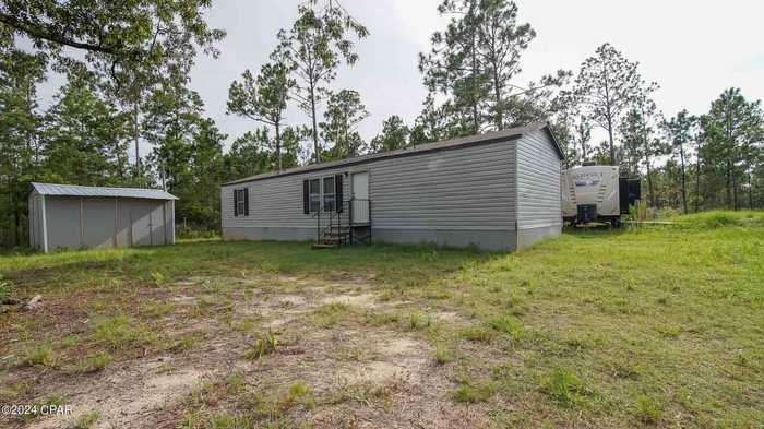 photo 1: 20771 NW MARIANNA LAKE Avenue, Fountain FL 32438