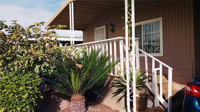 photo 1: 26235 9th Street Unit 69, Highland CA 92346