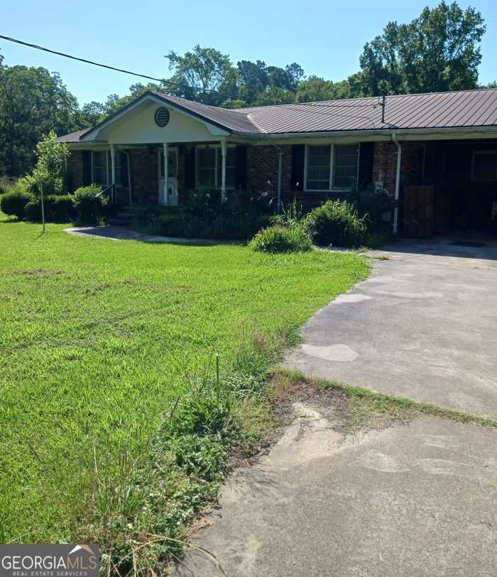 photo 1: 639 S Railroad Avenue, Twin City GA 30471