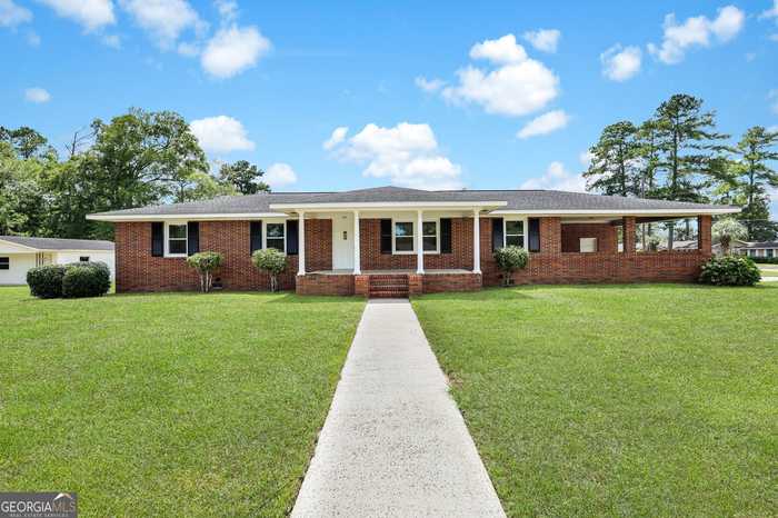 photo 1: 110 N Claxton Avenue, Claxton GA 30417