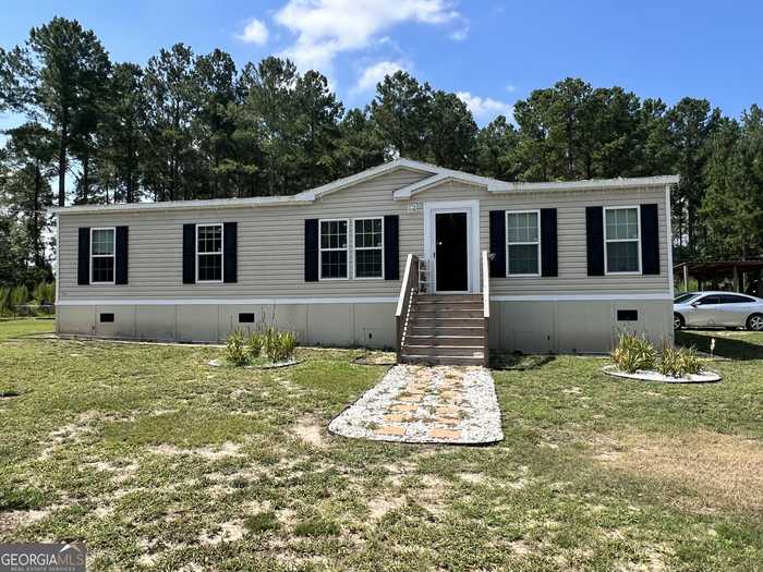 photo 1: 910 George Strickland Road, Claxton GA 30417