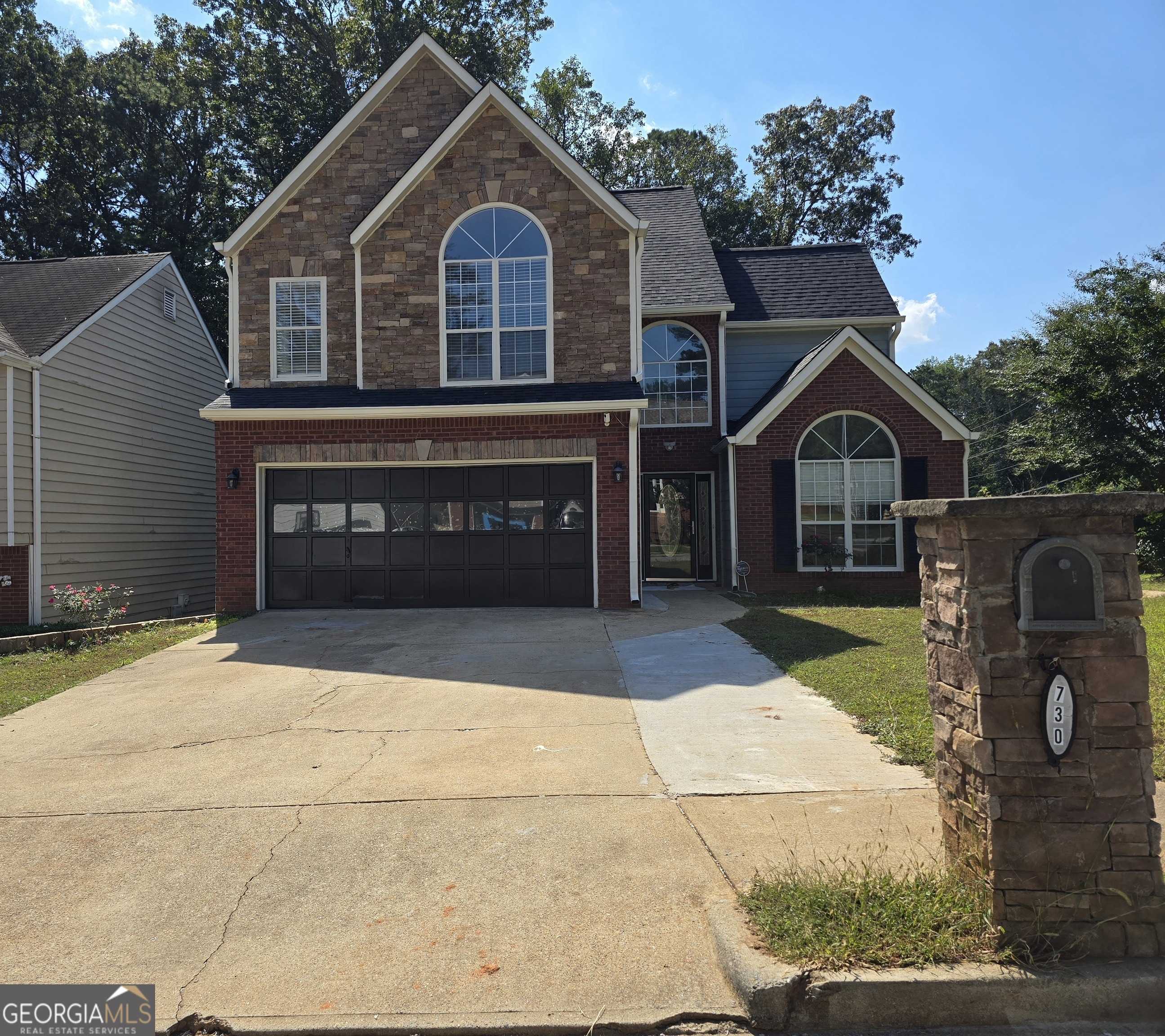 photo 1: 730 Durham Ridge Drive NW, Lilburn GA 30047