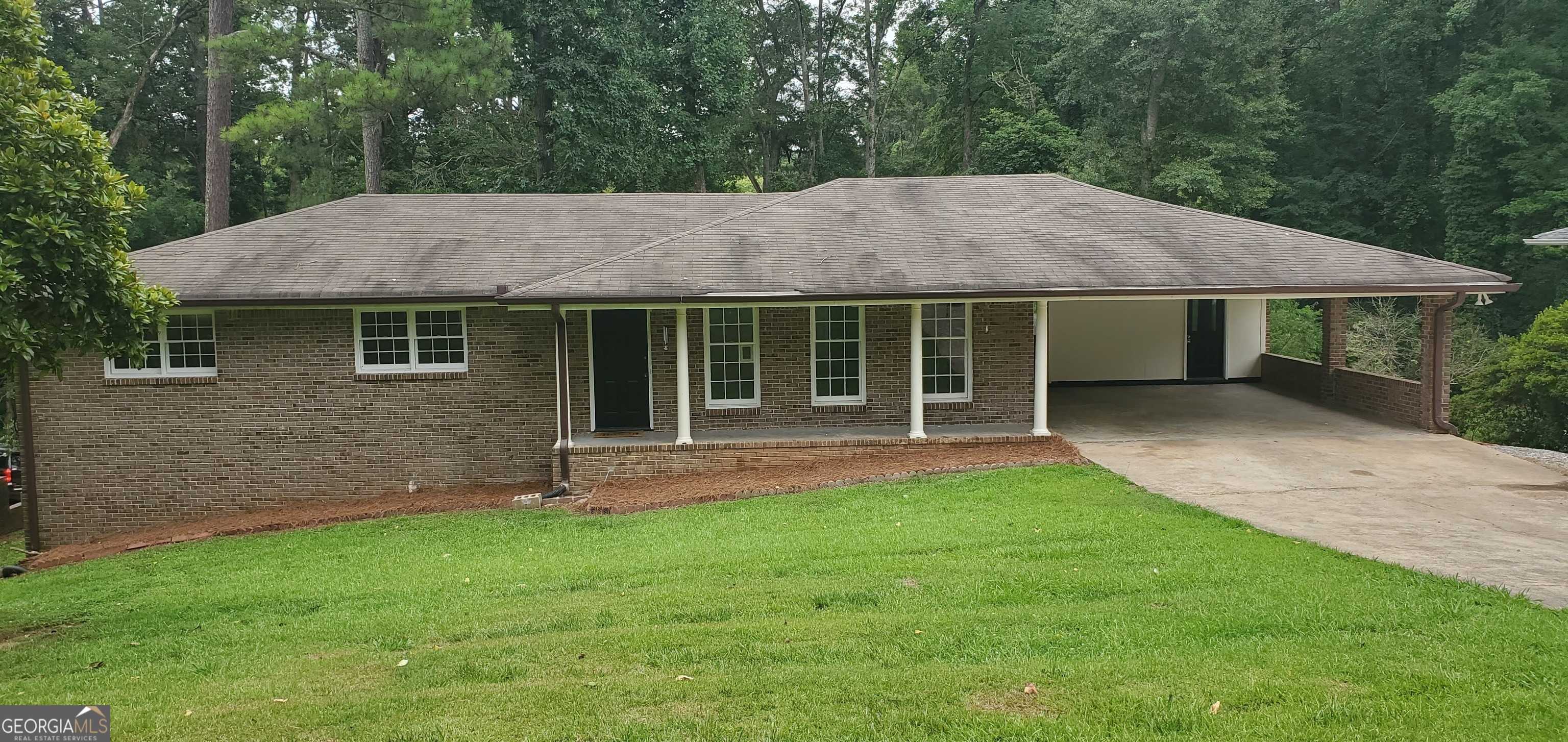 photo 1: 678 SOUTHWIND Drive NW, Lilburn GA 30047