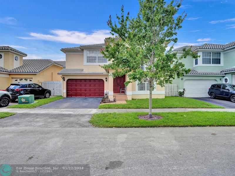 photo 1: 4224 NW 56th Dr, Coconut Creek FL 33073