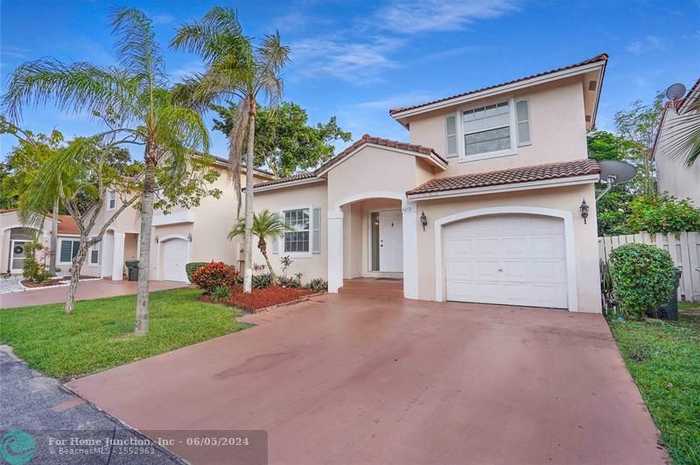 photo 1: 4272 NW 61st Ct, Coconut Creek FL 33073