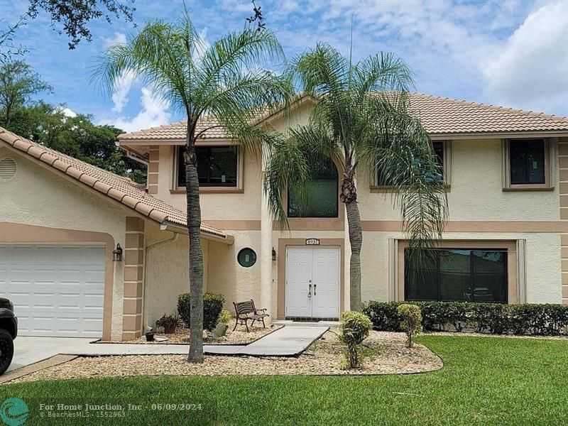 photo 1: 4931 NW 49th Ave, Coconut Creek FL 33073