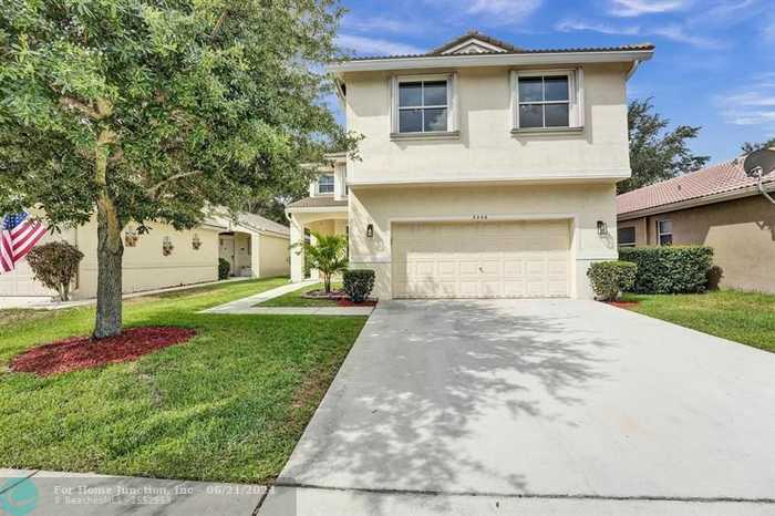 photo 1: 5406 NW 49th Ct, Coconut Creek FL 33073