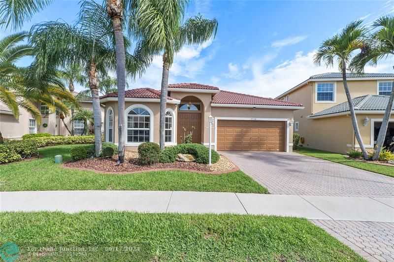 photo 1: 4728 NW 120th Dr, Coral Springs FL 33076