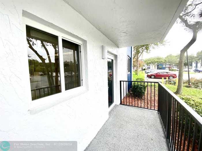 photo 1: 3190 Holiday Springs Blvd Unit 4-101, Pompano Beach FL 33063