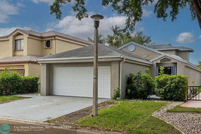 photo 1: 3410 NW 21st St, Coconut Creek FL 33066