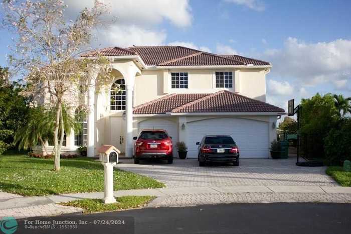 photo 1: 12306 NW 25th St, Coral Springs FL 33065