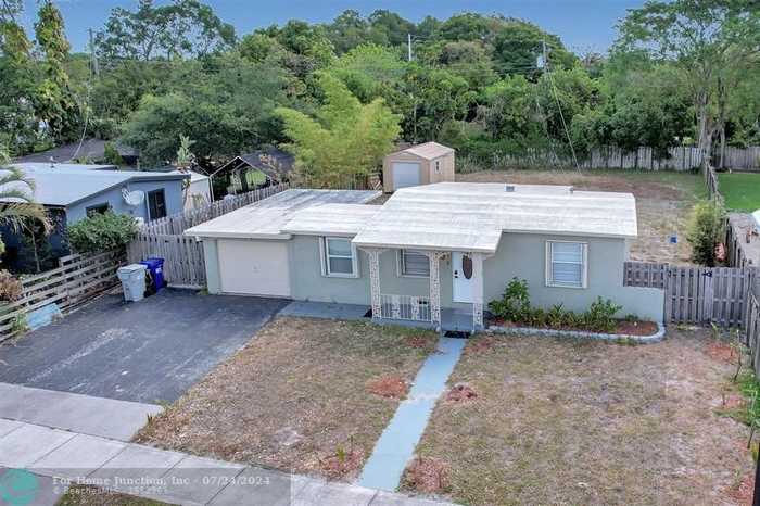 photo 1: 5048 NE 14th Ter, Pompano Beach FL 33064