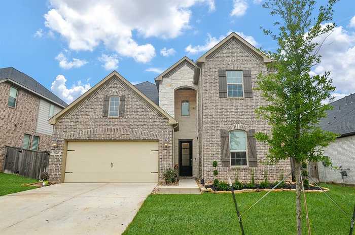 photo 1: 620 Cypress Bay Lane, Pinehurst TX 77362