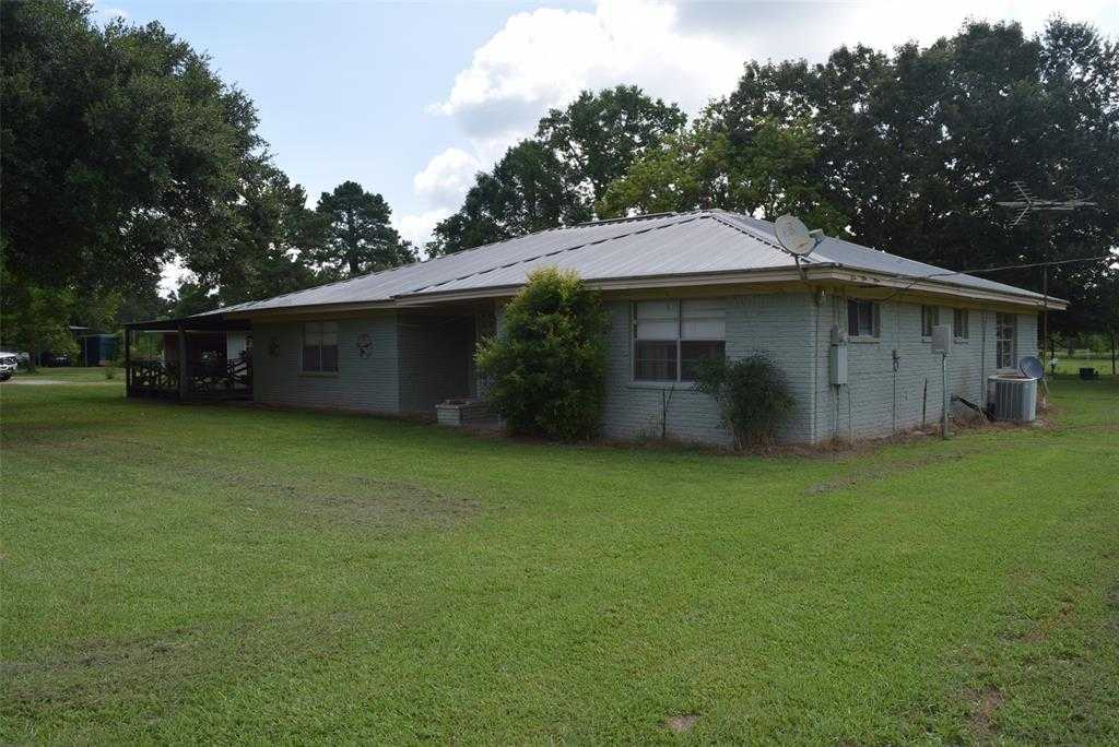 photo 1: 1034 County Road 2285, Cleveland TX 77327