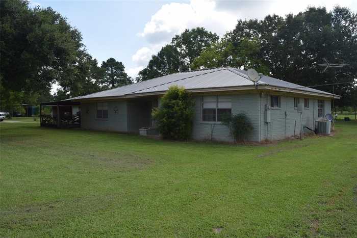 photo 1: 1034 County Road 2285, Cleveland TX 77327