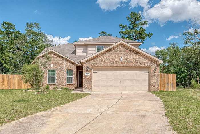 photo 1: 10793 Castle Rock Drive, Cleveland TX 77328