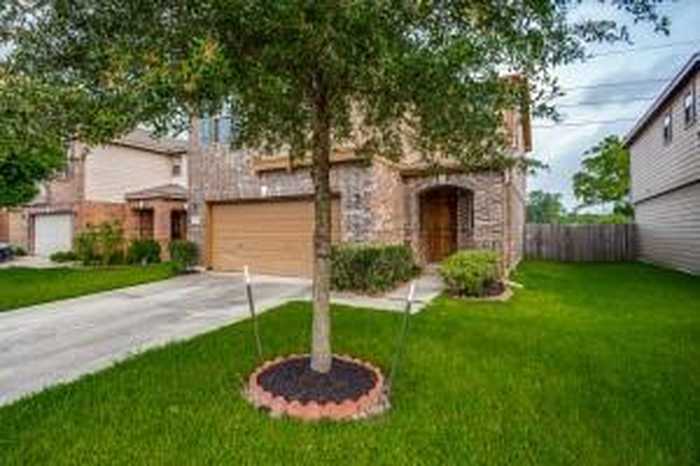 photo 1: 1114 Larks Trace Lane, Houston TX 77090