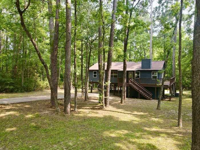 photo 1: 60 Brisbane Court, Coldspring TX 77331