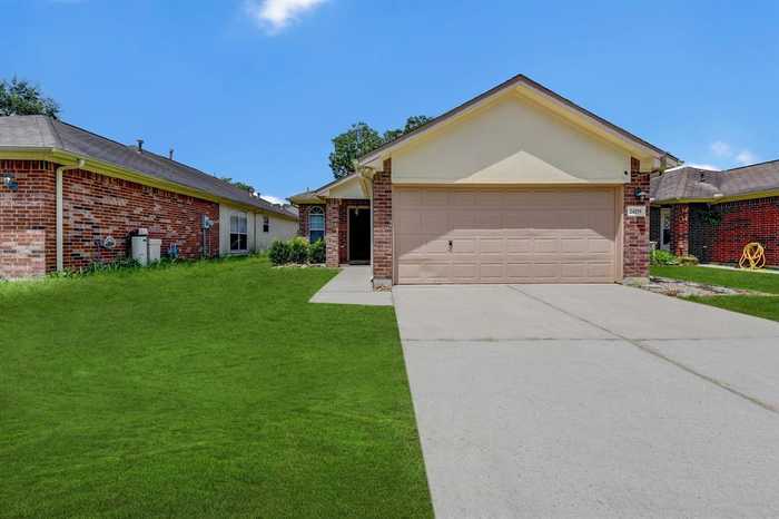 photo 1: 24219 Hard Wood Drive, Houston TX 77336