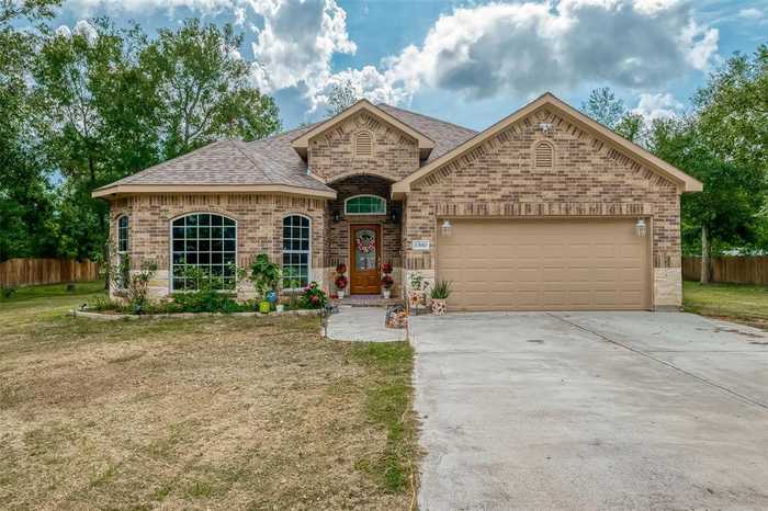 photo 1: 13910 Oak Forest Lane, Dayton TX 77535