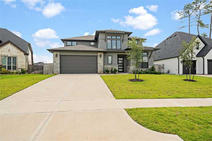 photo 2: 734 Platinum Stone Lane, Pinehurst TX 77362