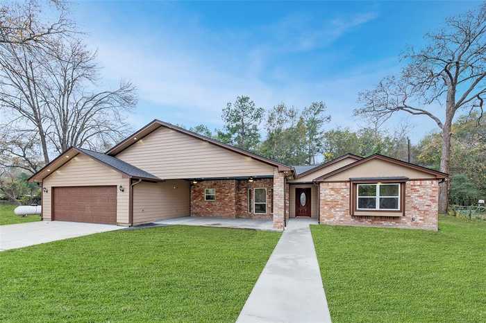 photo 1: 34803 High Oak Lane, Pinehurst TX 77362