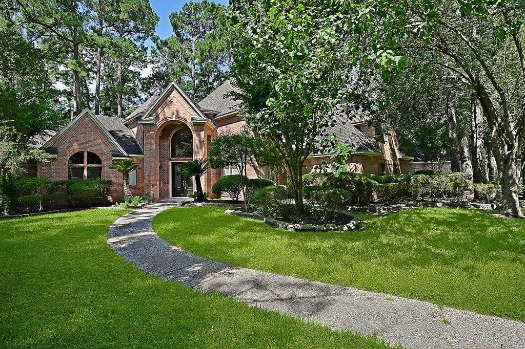 photo 1: 1611 Chestnut Grove Lane, Kingwood TX 77345