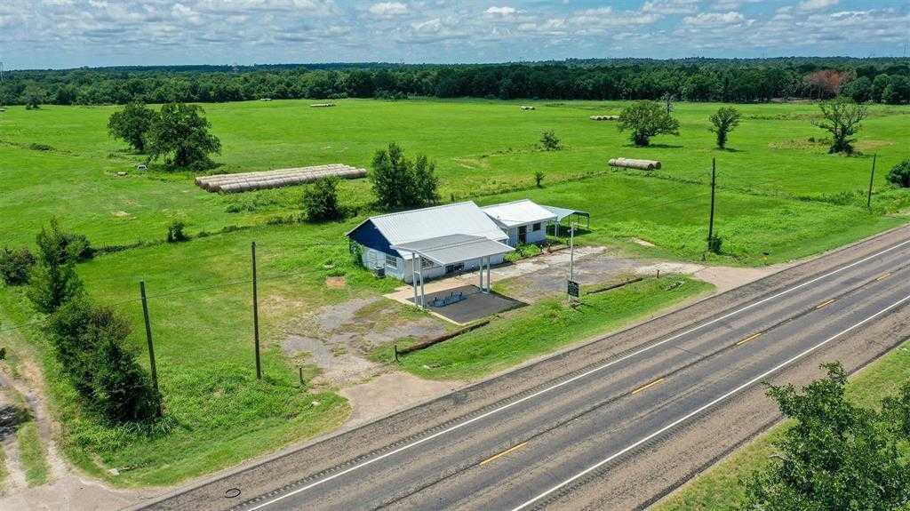 photo 1: 11833 Highway 90 N, Bedias TX 77831