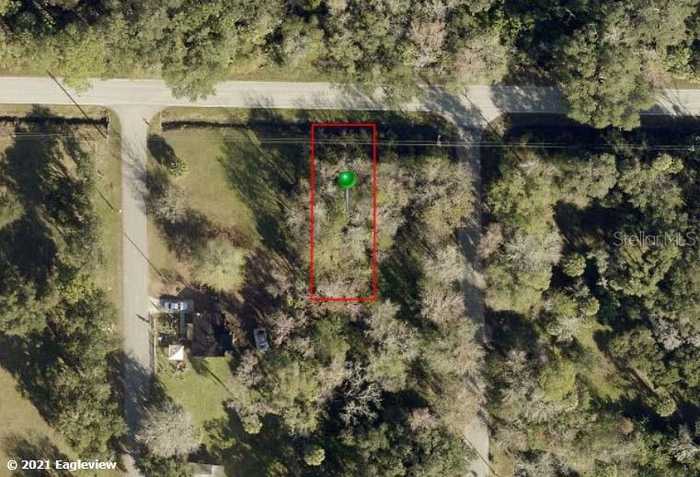 photo 1: W HALIFAX AVENUE, OAK HILL FL 32759