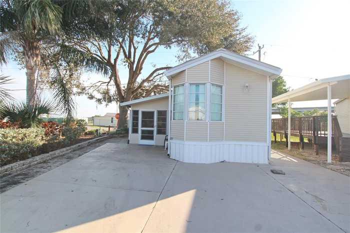 photo 1: 1159 DANIELS ROAD SE Unit 1, MOORE HAVEN FL 33471