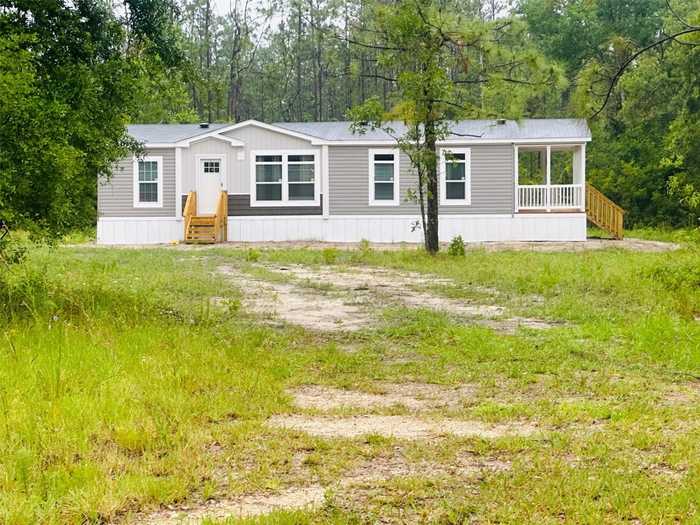 photo 1: 9809 CR 136 WEST W, LIVE OAK FL 32060