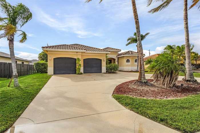 photo 1: 1708 BEACH PARKWAY W, CAPE CORAL FL 33914