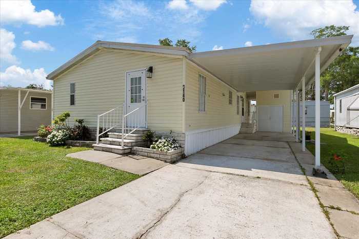 photo 1: 9140 BERKSHIRE LN, TAMPA FL 33635