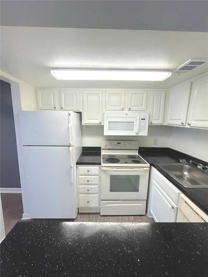 photo 2: 2531 N ALAFAYA TRAIL Unit 58, ORLANDO FL 32826