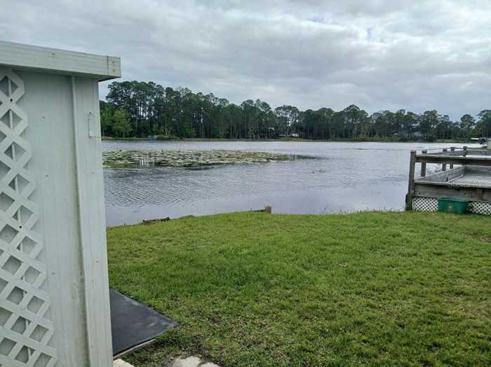 photo 2: 94 EAGLE POINT S, OSTEEN FL 32764