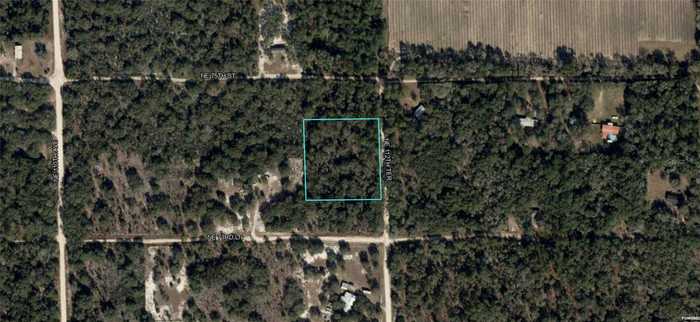 photo 1: 7450 NE 112TH TERRACE, BRONSON FL 32621