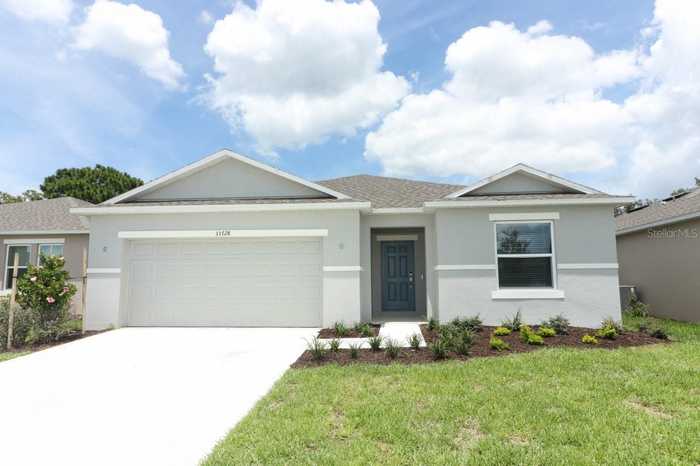 photo 1: 33728 SKY BLOSSOM CIRCLE, LEESBURG FL 34788