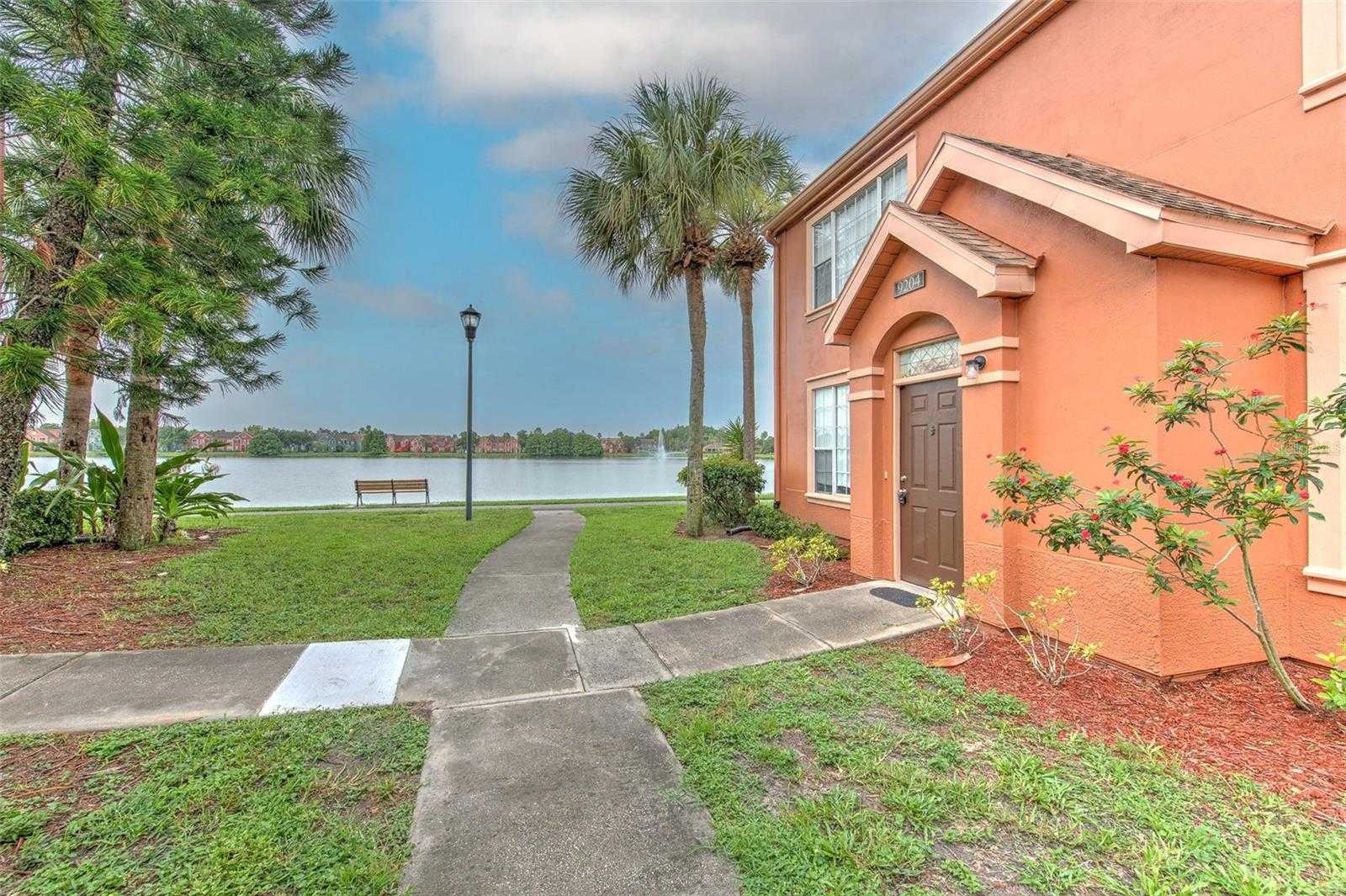 photo 1: 9204 LAKE CHASE ISLAND WAY Unit 9204, TAMPA FL 33626