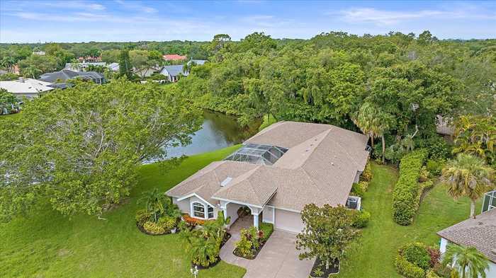 photo 1: 8117 MISTY OAKS BOULEVARD, SARASOTA FL 34243